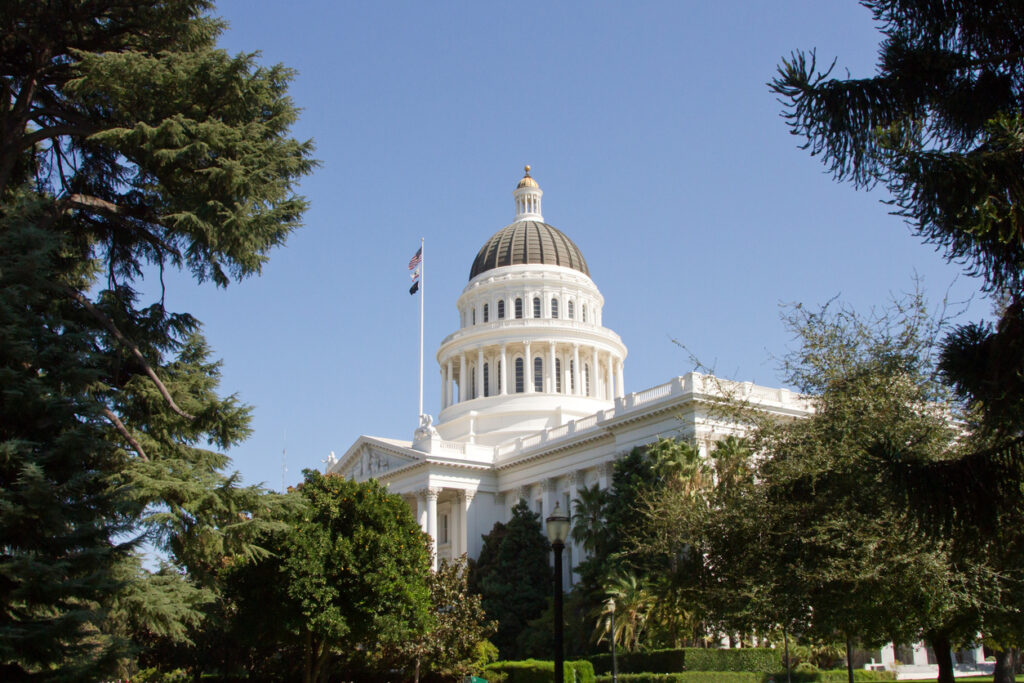 California's State Capitol surrounded by the trees of Capitol Park in Sacramento California. View is from the Southwest.